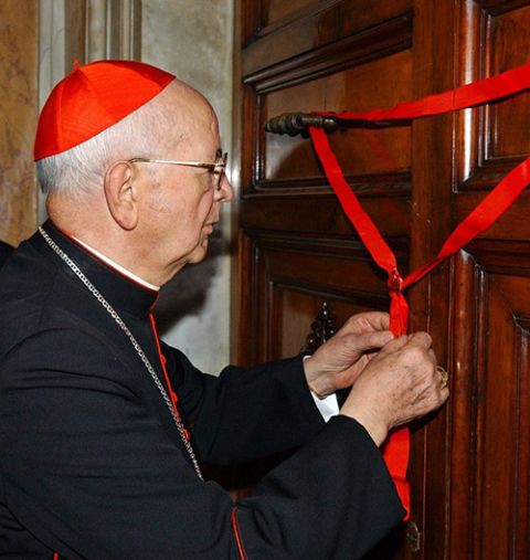 Cardinal Eduardo Martínez Somalo seals the door to St. John Paul II's apartment at the Vatican April 12, 2005. (CNS/L'Osservatore Romano)