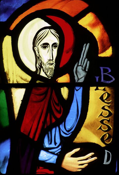 A church window depicts Jesus giving his Sermon on the Mount, which begins with the Beatitudes. (CNS/Crosiers)