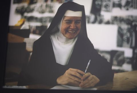 A photo of Sr. Corita Kent is seen at the Theological College in Washington Feb. 17. An art exhibit of her serigraphs, titled "Beauty and the Priest: Preaching with the Artwork of Corita Kent," was on display there through March 3. (CNS/Tyler Orsburn)