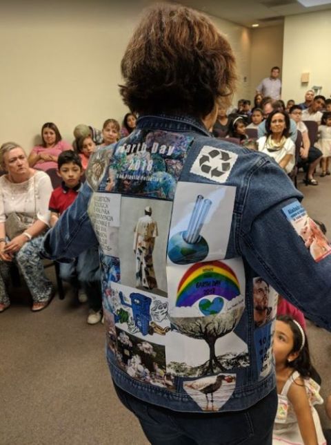 Diana Harper displays her environmental and Laudato Si'-inspired denim jacket during a bilingual Earth Day event in April 2018 at Our Mother of Sorrows Parish, in Tucson, Arizona. (Courtesy of Our Mother of Sorrows Parish)