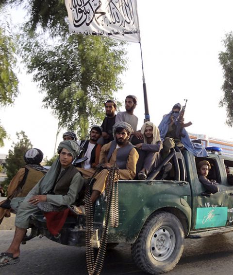 Taliban fighters patrol inside the city of Kandahar, southwest Afghanistan, Aug. 15. (AP/Sidiqullah Khan)