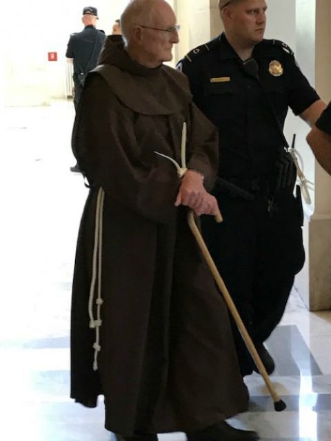U.S. Capitol Police arrest Franciscan Fr. Joseph Nangle at the rotunda of the Russell Senate building in Washington, D.C. in July 2019. (Courtesy of Fr. Joseph Nangle) U.S. Capitol Police arrest Franciscan Fr. Joseph Nangle at the rotunda of the Russell Senate building in Washington, D.C. in July 2019. (Courtesy of Fr. Joseph Nangle)
