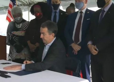 Virginia Gov. Ralph Northam signs legislation outside the Greensville Correctional Center in Jarratt March 24, 2021, making Virginia the 23rd state to abolish the death penalty. (CNS screen grab/Courtesy of Catholic Herald)