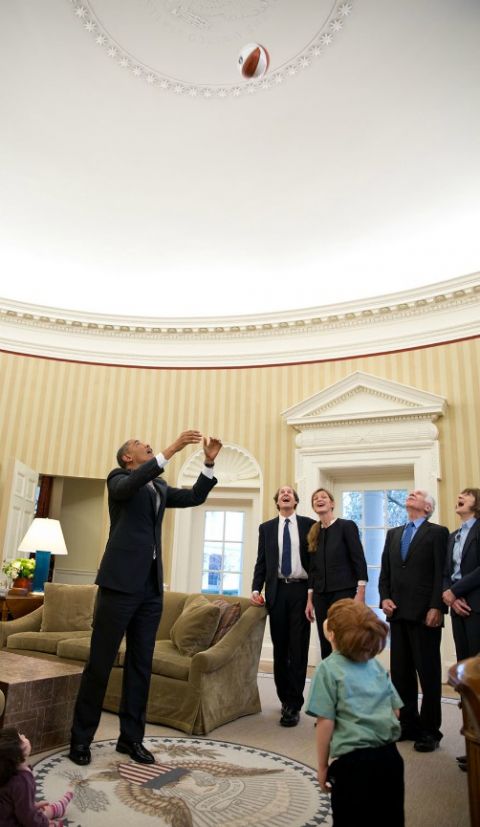 In February 2013, President Barack Obama throws a basketball to show Samantha Power and Cass Sunstein's children how high the Oval Office ceiling is. (Flickr/Obama White House/Pete Souza)