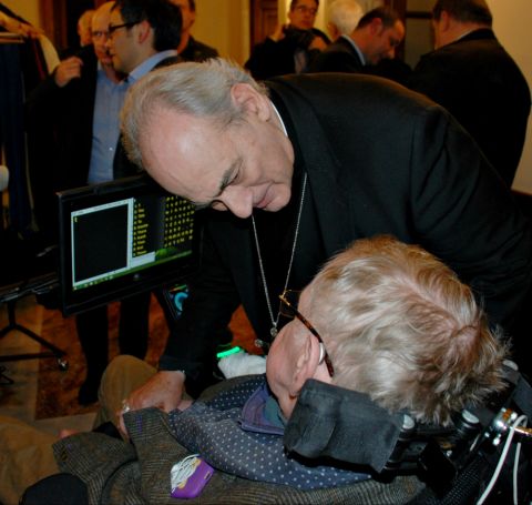 Bishop Marcelo Sánchez Sorondo, chancellor of the Pontifical Academy of Sciences, talks with physicist Stephen Hawking Nov. 30, 2016, during a break at a Vatican-sponsored conference on the power and limitations of artificial intelligence. (Pontifical Aca