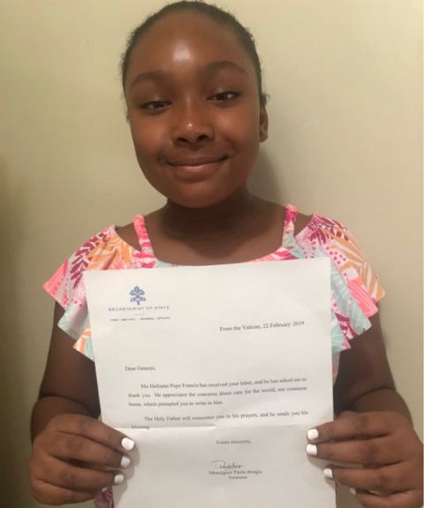 Genesis Butler holds the Feb. 22 letter she received from Msgr. Paolo Borgia, an official with the Vatican's Secretariat of State. (Courtesy of Million Dollar Vegan)