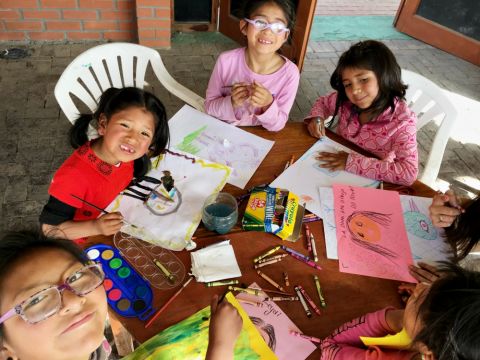 Girls from the Fundación Alalay children's home in Huajchilla, near La Paz, Bolivia, practice their drawing and painting skills. (Courtesy of Robert Aitchison)