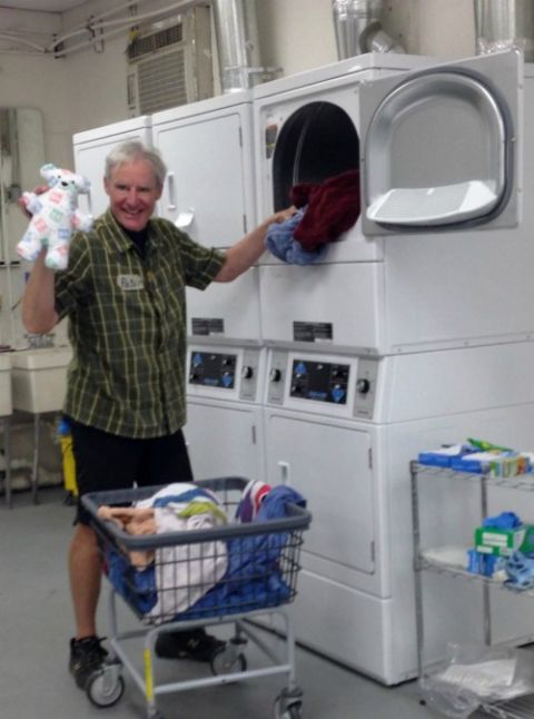 Peter Wise, a volunteer from the San Francisco Bay Area, helped with the essential behind-the-scenes work at Annunciation House in El Paso, Texas: washing tons of bedding, clothing and, occasionally, a stuffed animal. (Petrina Grube) Peter Wise, a volunteer from the San Francisco Bay Area, helped with the essential behind-the-scenes work at Annunciation House in El Paso, Texas: washing tons of bedding, clothing and, occasionally, a stuffed animal. (Petrina Grube)