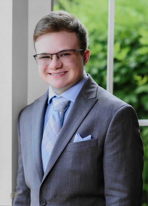 Mason Freeman, who is transgender, poses for a senior photo earlier this year. Many diocesan policies on gender identity and sexual orientation prohibit students from being openly transgender. (Courtesy of Mason Freeman)