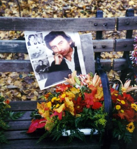 Photo of George Harrison with flowers on a park bench, Strawberry Fields, Central Park, New York