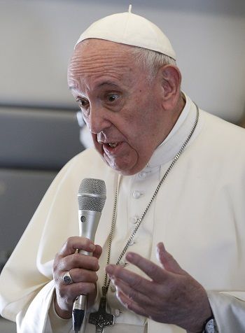 Pope Francis speaks with journalists aboard his flight from Baghdad to Rome March 8, 2021. (Paul Haring/CNS) Pope Francis aboard papal plane