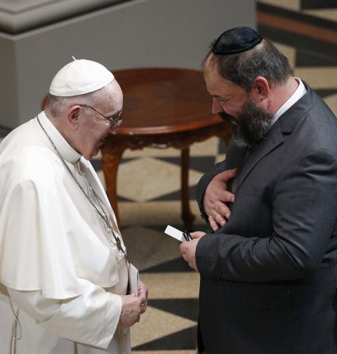 Pope Francis greets a religious leader during a meeting with representatives of the Ecumenical Council of Churches and several Jewish communities of Hungary at the Museum of Fine Arts in Budapest, Hungary, Sept. 12, 2021.