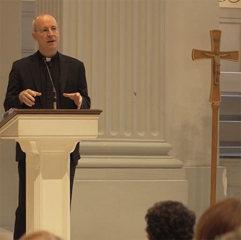 Jesuit Fr. James Martin speaks about LGBTQ rights to an audience in a still from the 2021 film "Building a Bridge." (NCR screenshot/Obscured Pictures)