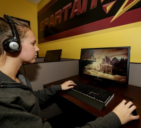 A student plays at St. Thomas Aquinas College's esports facility. (STAC Athletics/Dorice Arden)