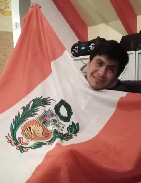 Felipe Vega Fernández displays a Peruvian flag. (Courtesy of Felipe Vega Fernández)