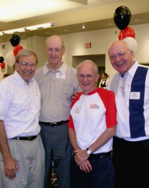 The founding priests of Iowa Citizens for Community Improvement pose for a photo at the group's 30th anniversary convention in 2005. From left: former priest Vince Hatt, Fr. Gene Kutsch, former priest Joe Fagan, and Fr. Tom Rhomberg. (Courtesy of Iowa CCI