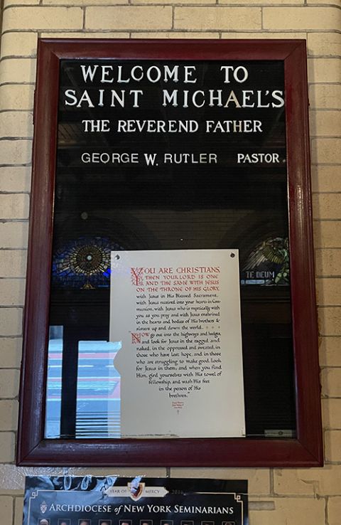 A parish announcement board inside the Church of St. Michael in midtown Manhattan, New York, on Dec. 1 (NCR photo)