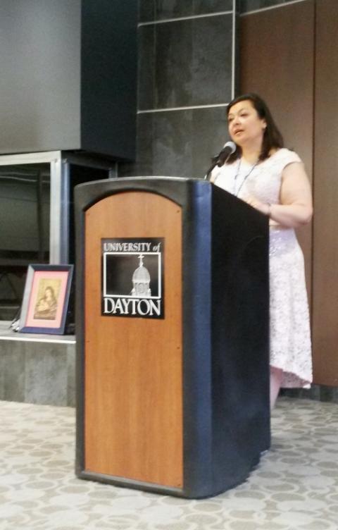 Neomi De Anda delivers her presidential address at a June 4 "Banquet y Fiesta" during the 2019 ACHTUS Colloquium at the University of Dayton. (NCR photo/Maria Benevento)