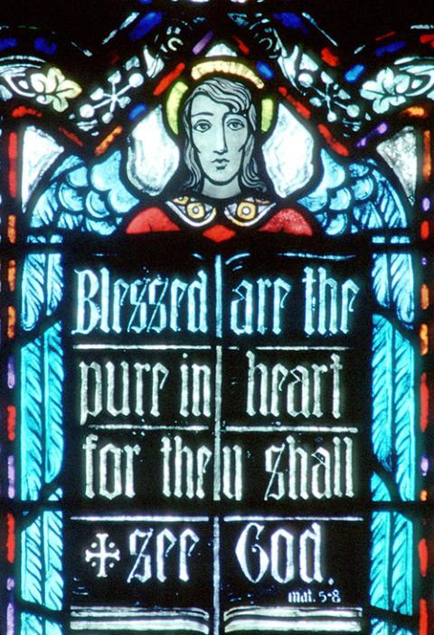 One of the Beatitudes is displayed in a church window. (CNS/Crosiers)