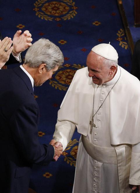 Pope Francis shakes hands with then-U.S. Secretary of State John Kerry as the pope enters the House of Representatives Chamber to address a joint meeting of Congress at the U.S. Capitol in Washington Sept. 24, 2015. (CNS/Paul Haring)