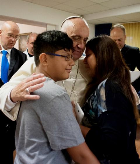 Pope Francis visits patients at the Villa Speranza hospice, which is connected to Gemelli Hospital, in Rome Sept. 16, 2016. The visit was part of the pope's series of Friday works of mercy during the Holy Year. (CNS/L'Osservatore Romano, handout) Pope Francis visits patients at the Villa Speranza hospice, which is connected to Gemelli Hospital, in Rome Sept. 16, 2016. The visit was part of the pope's series of Friday works of mercy during the Holy Year. (CNS/L'Osservatore Romano, handout)