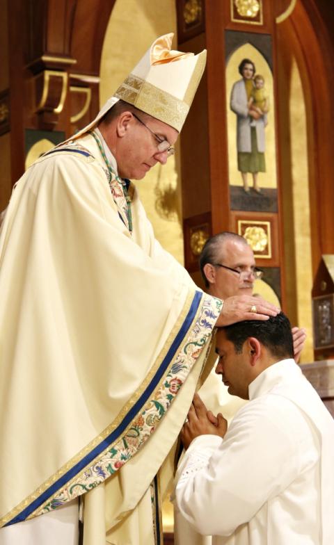 Bishop John Barres of Rockville Centre, New York, lays hands on Deacon Ralph Colon during the ordination of permanent deacons June 3 at St. Agnes Cathedral in Rockville Centre. (CNS/Gregory A. Shemitz) Bishop John Barres of Rockville Centre, New York, lays hands on Deacon Ralph Colon during the ordination of permanent deacons June 3 at St. Agnes Cathedral in Rockville Centre. (CNS/Gregory A. Shemitz)