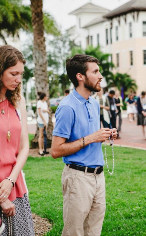 Missionaries with FOCUS pray the rosary during a June 13, 2017, procession in Ave Maria, Florida. (CNS/Courtesy of FOCUS)