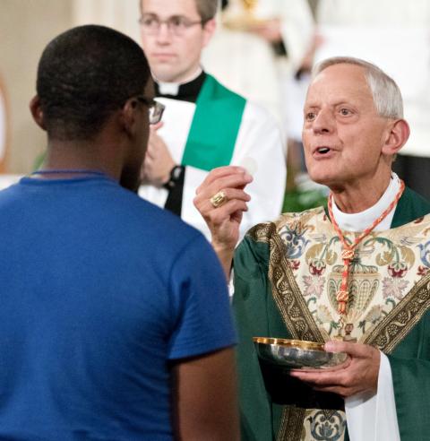 Cardinal Donald Wuerl distributes Communion to a World Youth Day Unite participant at the Basilica of the National Shrine of the Immaculate Conception in Washington July 22. (CNS/Courtesy of Archdiocese of Washington/Daphne Stubbolo) Cardinal Donald Wuerl distributes Communion to a World Youth Day Unite participant at the Basilica of the National Shrine of the Immaculate Conception in Washington July 22. (CNS/Courtesy of Archdiocese of Washington/Daphne Stubbolo)