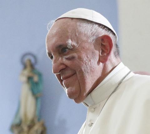 Pope Francis visits the Shrine of St. Peter Claver in Cartagena, Colombia, Sept. 10. The pope cut his head in the popemobile when it braked suddenly. (CNS/Paul Haring) Pope Francis visits the Shrine of St. Peter Claver in Cartagena, Colombia, Sept. 10. The pope cut his head in the popemobile when it braked suddenly. (CNS/Paul Haring)