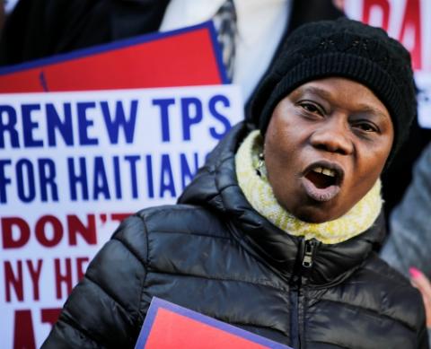 A woman participates in an immigration rally for Haitians Nov. 21, 2017, in New York. The previous day, Trump administration had announced that Haitians with temporary protected status must leave the country by July 22, 2019. (CNS/Reuters/Eduardo Munoz)