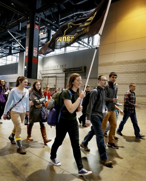 Students from Michigan Tech University in Houghton carry the school's flag after the closing Mass Jan. 6 at a conference sponsored by the FOCUS in Chicago. (CNS/Chicago Catholic/Karen Callaway)