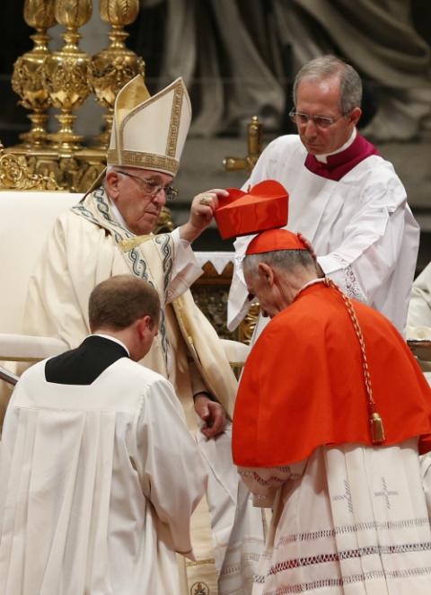 New Cardinal Luis Ladaria, prefect of the Congregation for the Doctrine of the Faith, receives his red biretta from Pope Francis during a consistory to create 14 new cardinals in St. Peter's Basilica at the Vatican June 28, 2018. (CNS/Paul Haring)