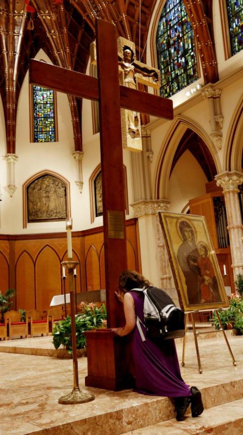 A young adult venerates the World Youth Day Cross following Mass Aug. 20 at Holy Name Cathedral in Chicago. (CNS/Chicago Catholic/Karen Callaway) A young adult venerates the World Youth Day Cross following Mass Aug. 20 at Holy Name Cathedral in Chicago. (CNS/Chicago Catholic/Karen Callaway)