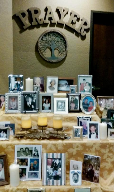 A shrine for departed family and friends at Holy Communion Church (NCR photo/Peter Feuerherd)