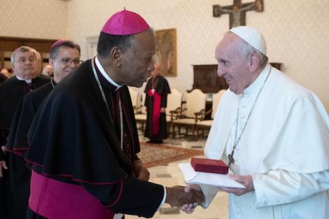 Pope Francis greets Bishop Edward K. Braxton of Belleville, Ill., during a meeting with U.S. bishops from Illinois, Indiana, and Wisconsin making their "ad limina" visits to the Vatican Dec. 12, 2019. (CNS photo/Vatican Media)