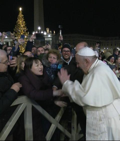Pope Francis slaps a woman's hand after she grabbed his hand while walking to visit the Nativity scene in St. Peter's Square at the Vatican Dec. 31, 2019. (CNS/Vatican Media)