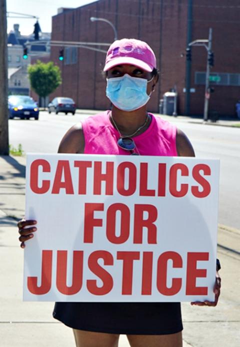 Kenya Turner, a member of St. Martin de Porres Church in Louisville, Kentucky, joins the "Black Catholics Unite: Stand For Justice March" on June 6. (CNS/Courtesy of The Record)
