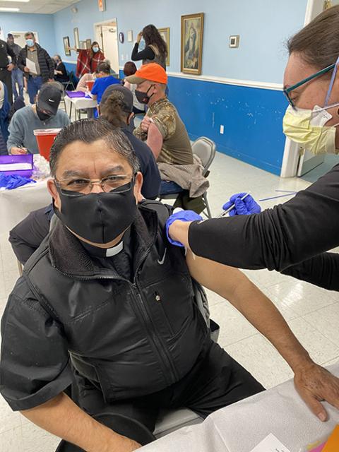 Fr. Gabriel Carvajal Salazar get his COVID-19 vaccine at Our Lady of the Highways Church in Thomasville, North Carolina, March 6. (CNS/Catholic News Herald/Joe Thornton)