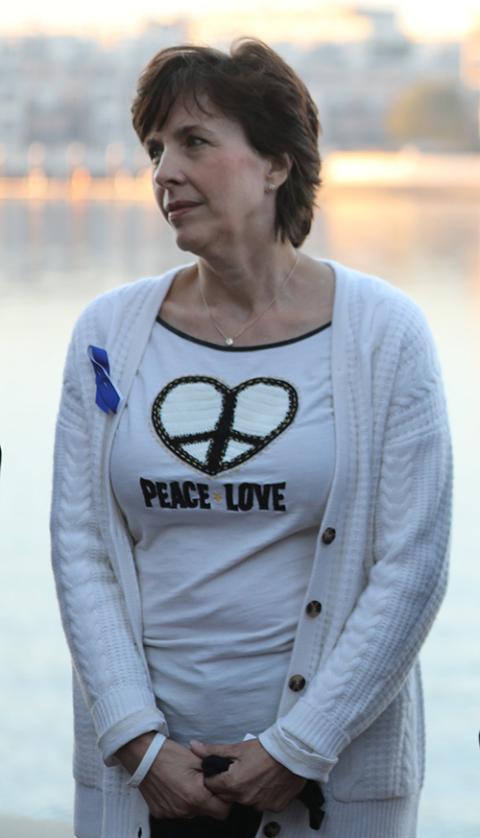 Jennifer Wortham joins others in prayer during a sunrise walk to end abuse Nov. 18 in Baltimore. (CNS photo/Bob Roller)