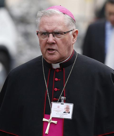 Archbishop Mark Coleridge of Brisbane, Australia, arrives for a session of the Synod of Bishops on the family at the Vatican Oct. 14, 2013. (CNS/Paul Haring)