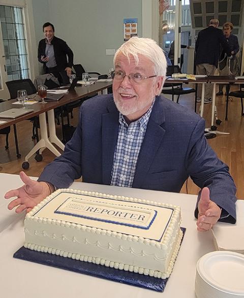 The NCR Board of Directors celebrates Publisher Bill Mitchell's retirement at their meeting in Los Angeles in November. (NCR photo/Heidi Schlumpf)