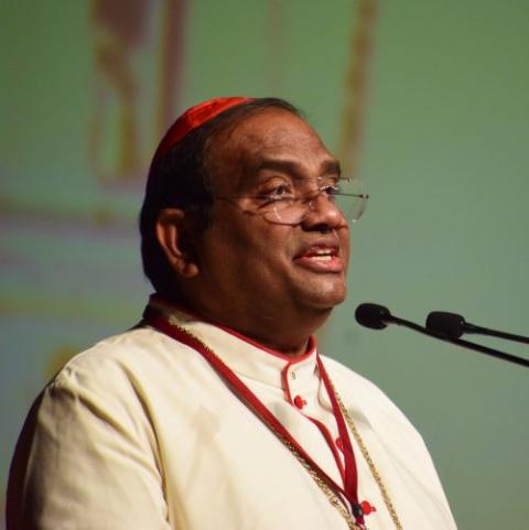 Cardinal Anthony Poola at microphone