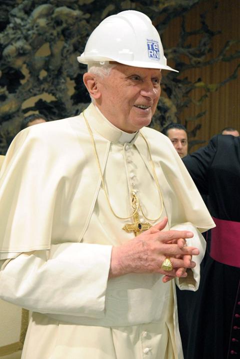 Pope Benedict XVI smiles as he wears a steel workers hard hat, a gift from workers in Terni, Italy, at the end of an audience in Paul VI hall at the Vatican March 26, 2011. (CNS/L'Osservatore Romano via Reuters)