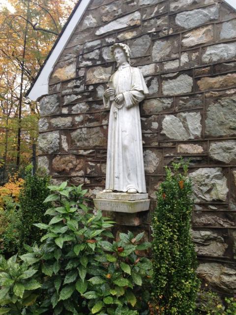 A statue of St. Elizabeth Ann Seton at the back of Corpus Christi Chapel overlooks "her rock" at the National Shrine Grotto of Our Lady of Lourdes in Emmitsburg, Maryland. (Courtesy of the National Shrine Grotto)