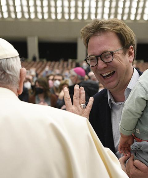Pope Francis greets Christopher Lamb, Rome correspondent for The Tablet, during a general audience in the Paul VI hall at the Vatican Feb. 16, 2022. (CNS/Vatican Media)
