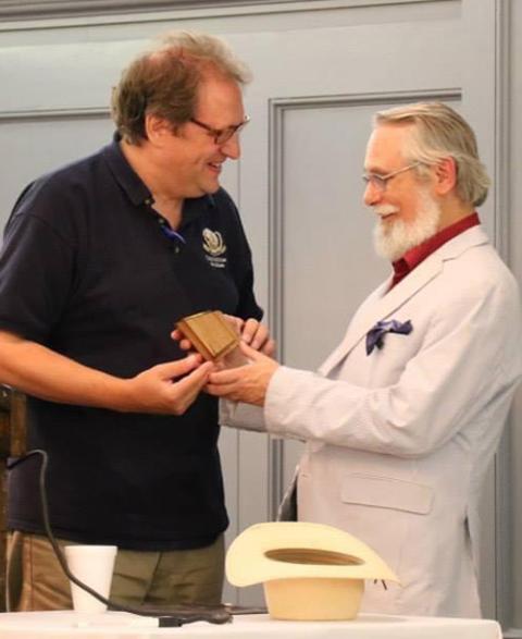 John Médaille receives the 2015 Outline of Sanity award from Chesterton Society President Dale Ahlquist. (Courtesy of John Médaille)