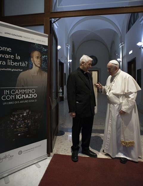 Pope Francis talks with Fr. Arturo Sosa, superior general of the Jesuits, after a Mass at the Jesuit Church of the Gesù in Rome March 12, 2022. (CNS/Vatican Media)