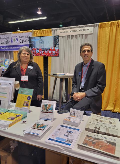 Laure Krupp and Joe Ferullo staff NCR's booth at LA Religious Education Congress. (NCR photo/Heidi Schlumpf)