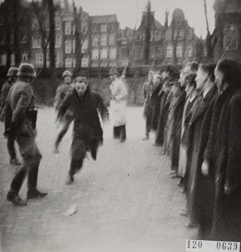 German police round up Jewish men at Jonas Daniël Meijerplein, a square in Amsterdam, in February 1941. (Wikimedia Commons)
