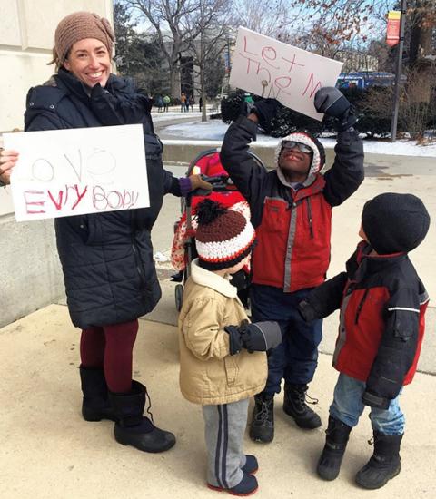 Shannon with her children and a friend's child at an immigration action in 2018. (Courtesy of Shannon Evans)